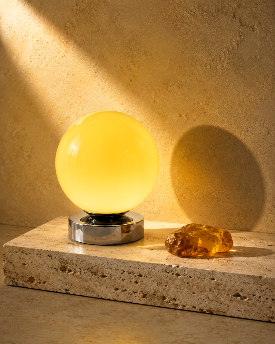 Nova Corona cream glass globe table lamp on a low chrome-finish base