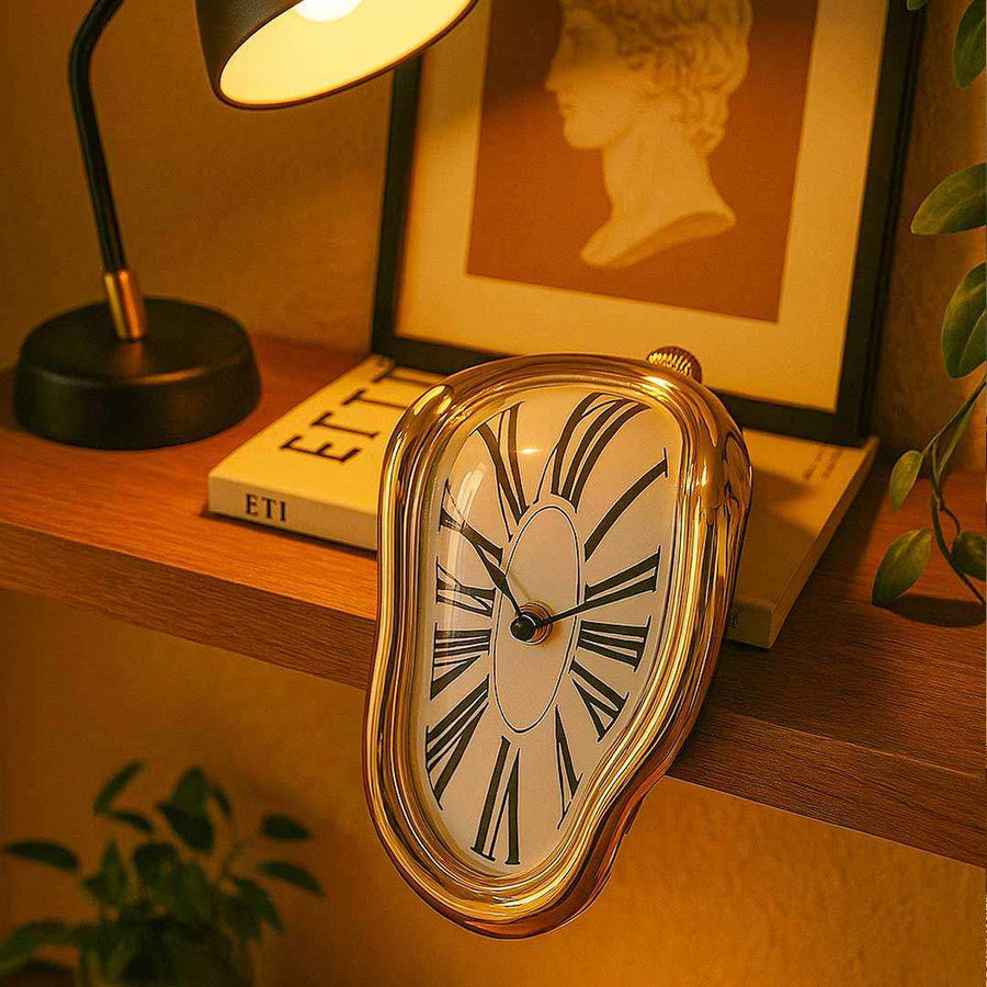 Gold Melting Clock draped over the edge of a shelf