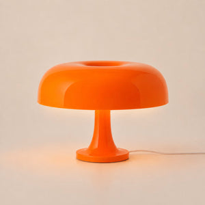 Orange 1970s-style mushroom table lamp with a domed shade