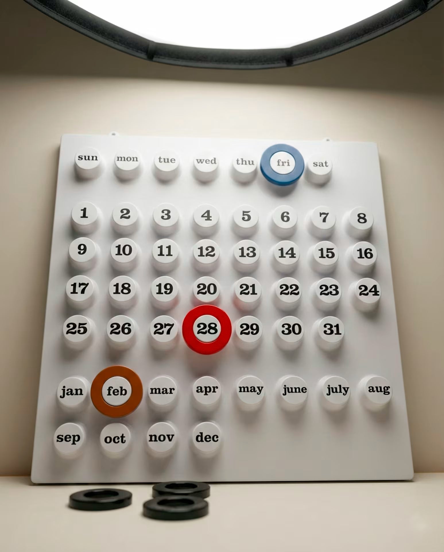 Perpetual Retro Analogue Calendar styled on a wall