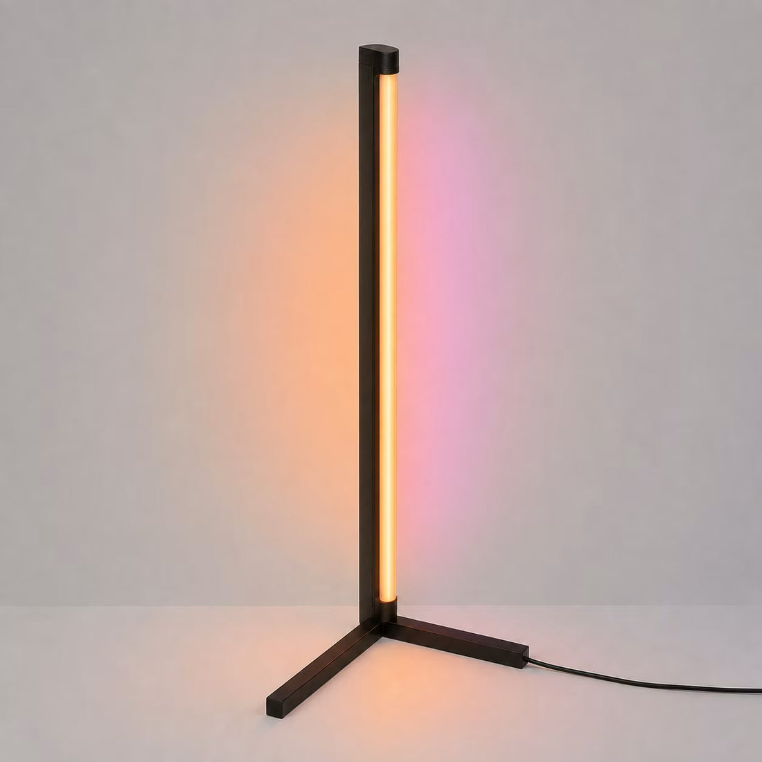Remote-controlled RGB corner floor lamp shown beside a wall