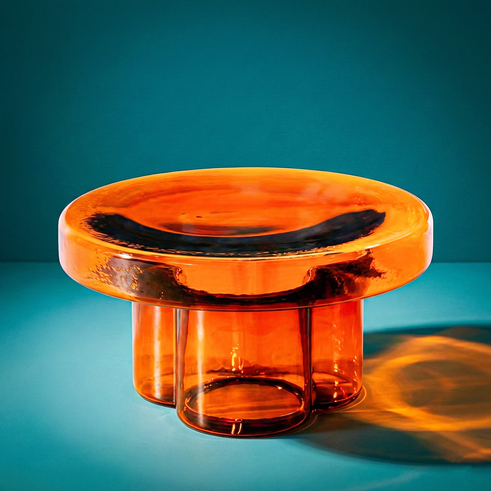 Short Aperol glass coffee table with metal base plate