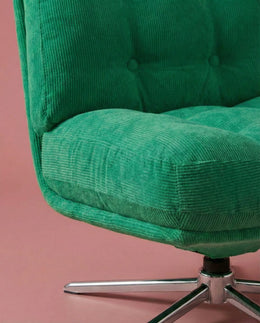 Green corduroy upholstery and electroplated base detail on The Archive Chair