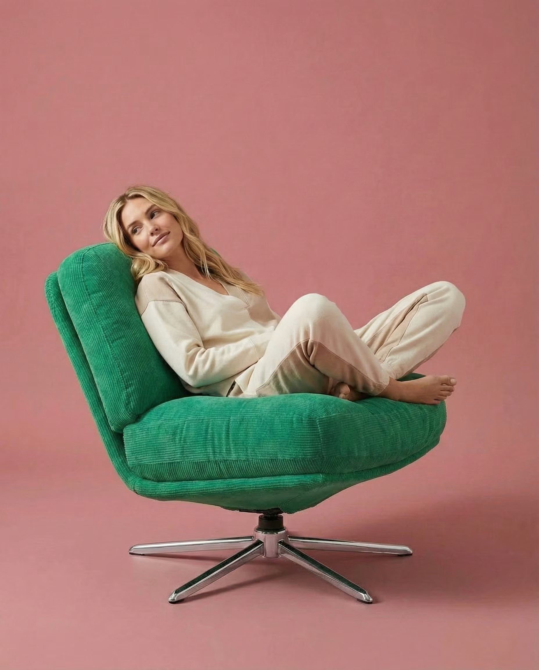 Front view of The Archive green corduroy lounge chair
