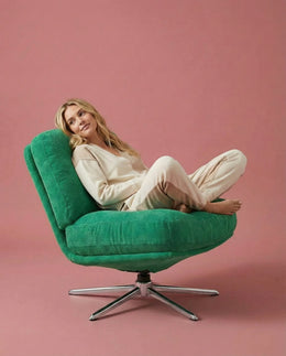 Front view of The Archive green corduroy lounge chair