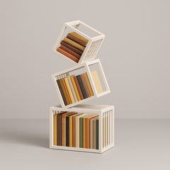White geometric bookshelf styled with books and objects