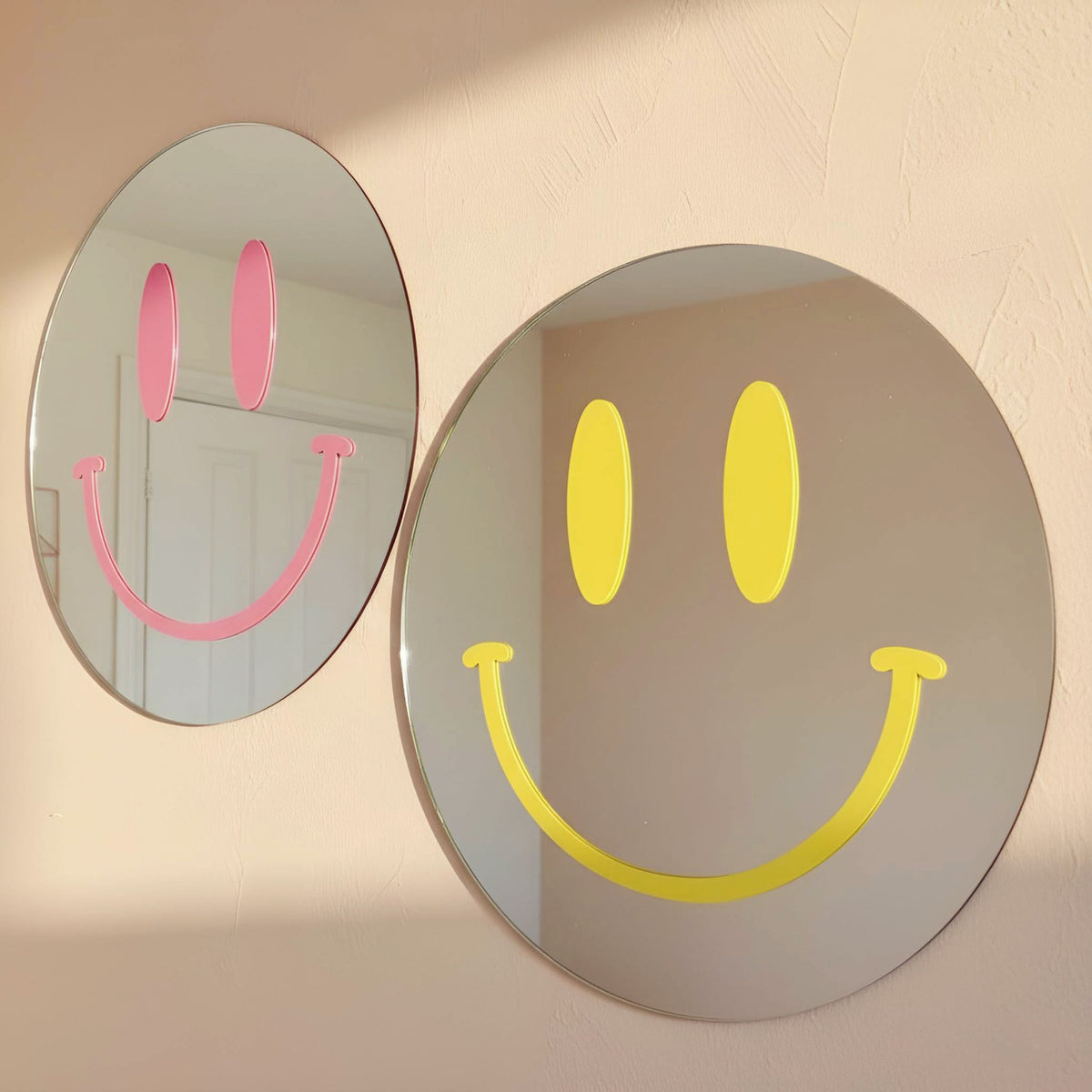 Pink and yellow Smiling Reflections mirrors styled together in a colourful room