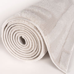 Chalk Form Rug — rolled side view