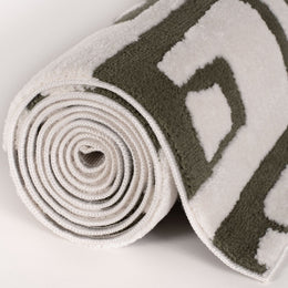 Moss Form Rug — rolled side view
