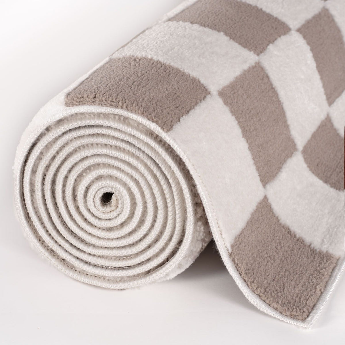 Sand Tile Rug — rolled side view