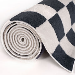 Cobalt Tile Rug — rolled side view