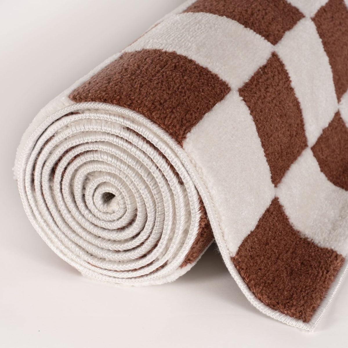 Clay Tile Rug — rolled side view