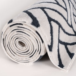 Cobalt Chevron Rug — rolled side view