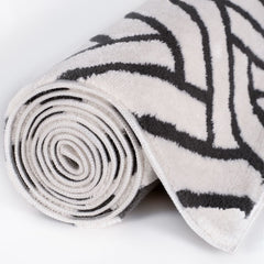 Slate Chevron Rug — rolled side view