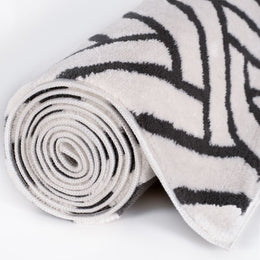 Slate Chevron Rug — rolled side view