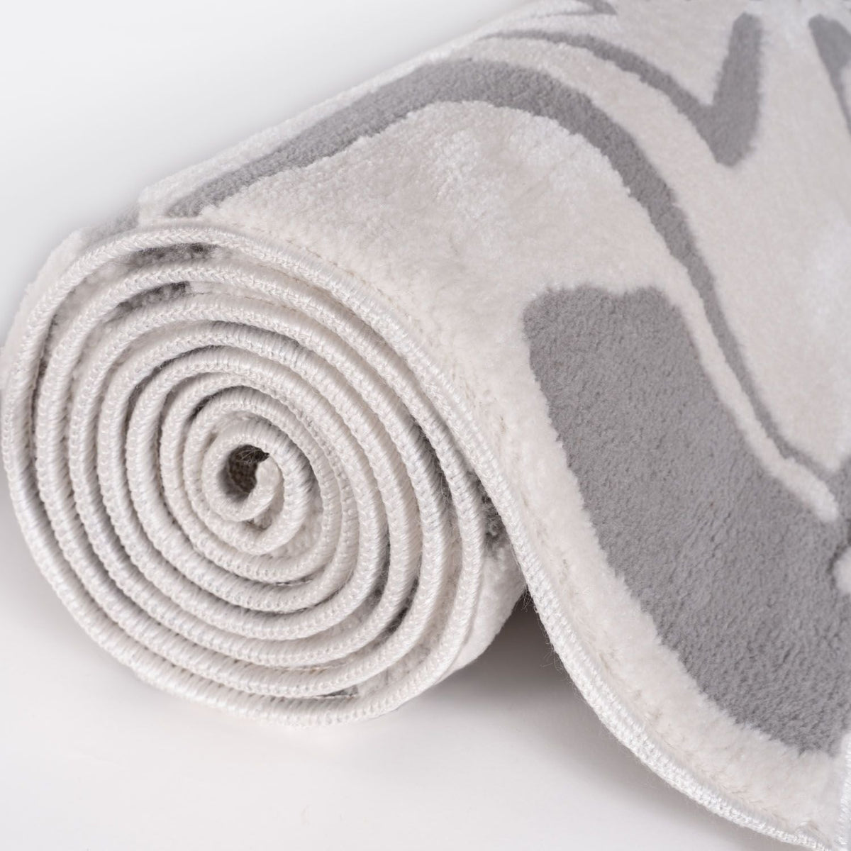 Silver Form Rug — rolled side view