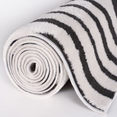 Slate Frame Rug — rolled side view
