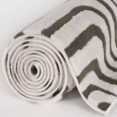 Olive Frame Rug — rolled side view
