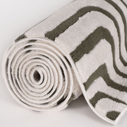 Olive Frame Rug — rolled side view