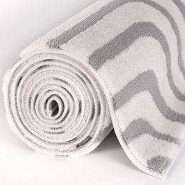 Silver Frame Rug — rolled side view