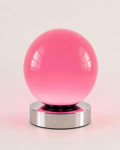 Low-profile pink globe bedside lamp with nine brightness levels