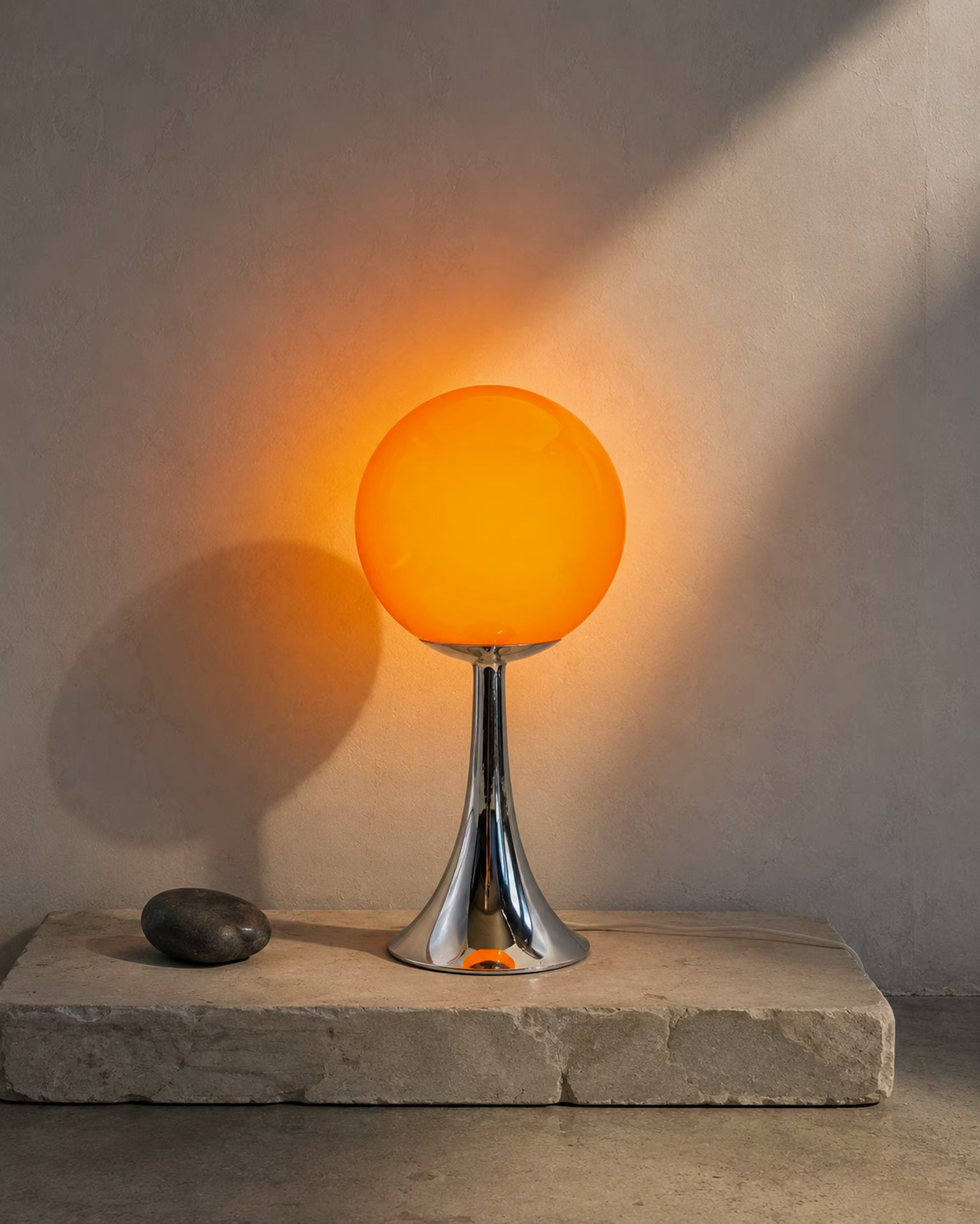 Pulsar Flare orange glass table lamp with chrome-finish stem and base