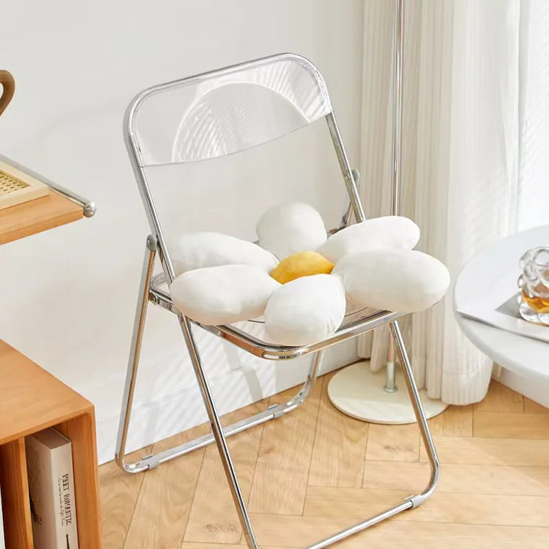 Curved plastic seat and back of the Minimal Folding Chair