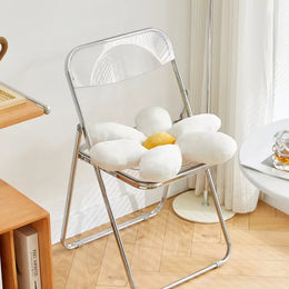 Curved plastic seat and back of the Minimal Folding Chair