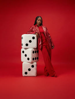 Dice Footstool styled with colourful home accessories