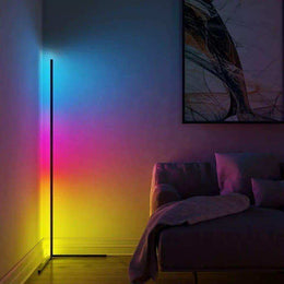 Compact RGB corner lamp creating colour along the wall