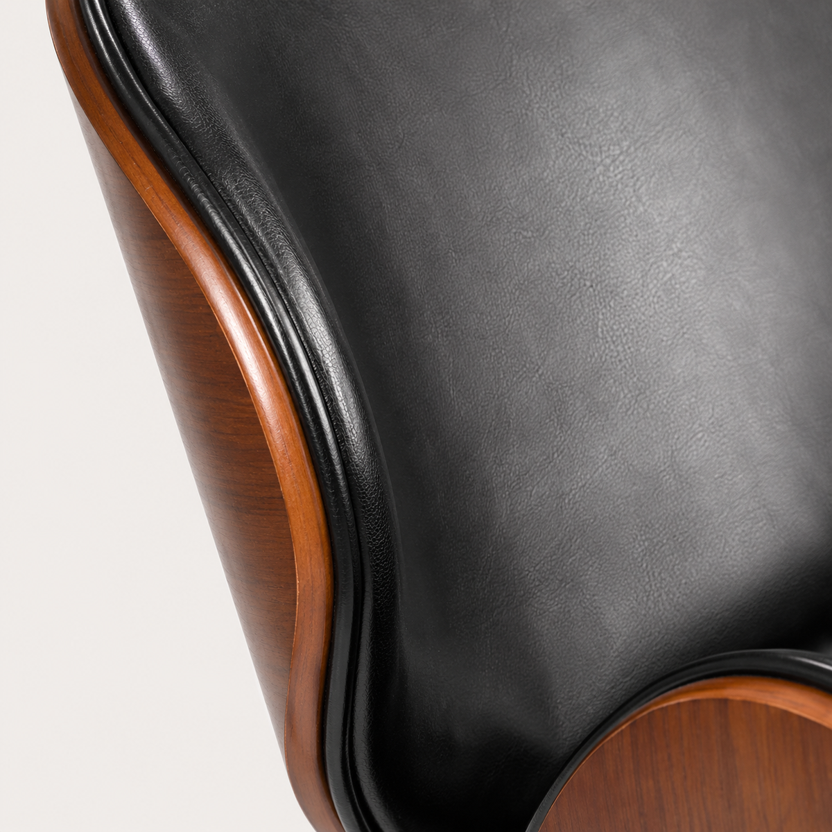 Black faux leather upholstery and contoured backrest on The Arden Office Chair