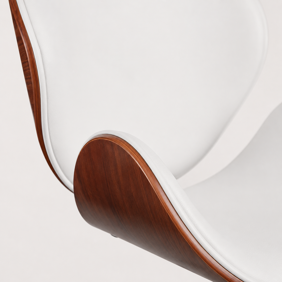 White faux leather upholstery and contoured backrest on The Arden Office Chair