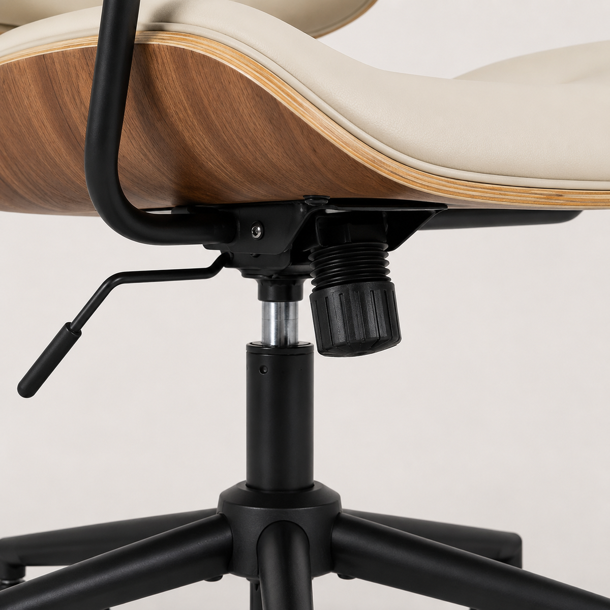 Black five-star base and castors on The Calder Office Chair in Beige