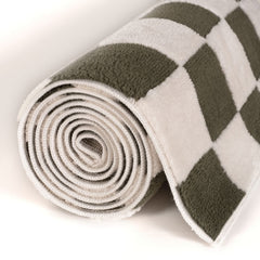 Moss Tile Rug — rolled side view