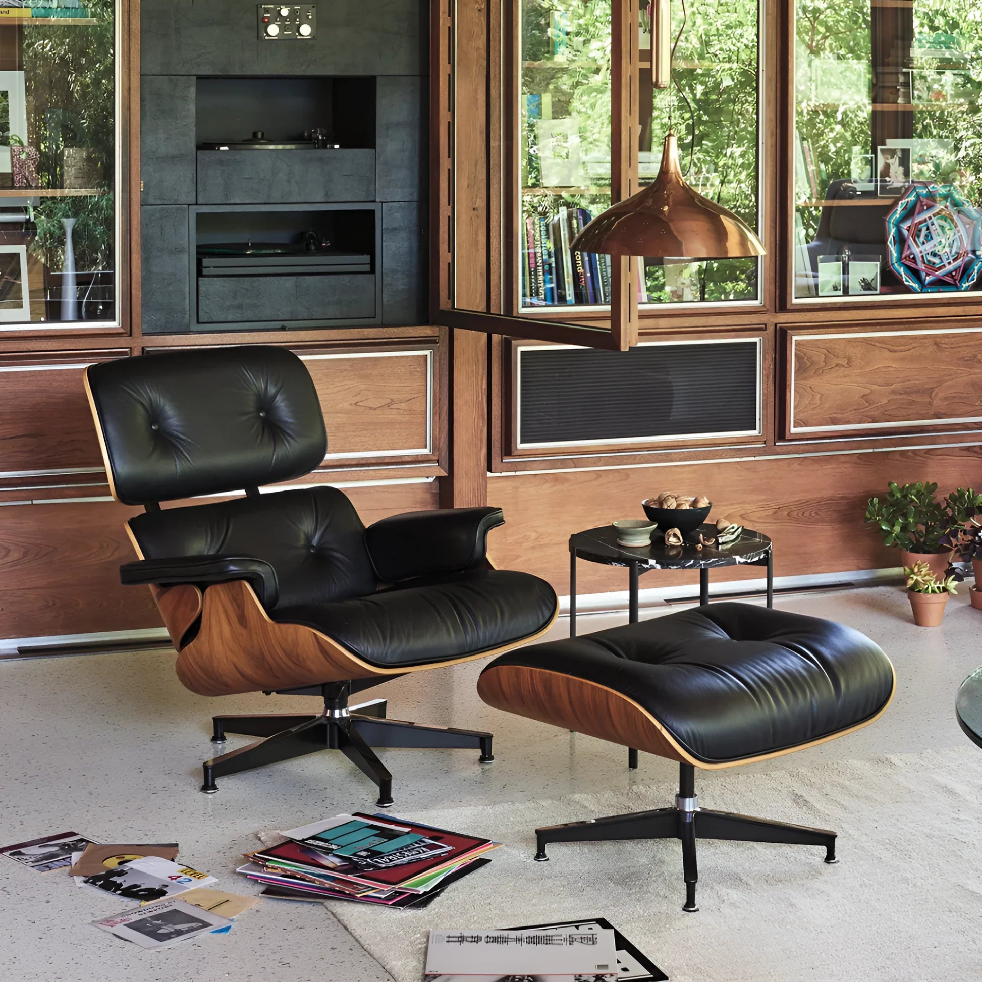 The Legacy Leather Lounge Chair and Ottoman in black leather with a walnut-finish shell