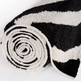 Mono Stripe Rug — rolled side view