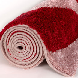 Cherry Stripe Rug — rolled side view