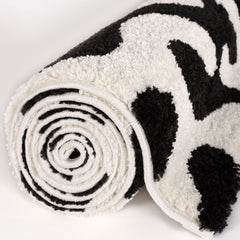 Ink Scribble Rug — rolled side view