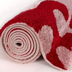 Cherry Scribble Rug — rolled side view