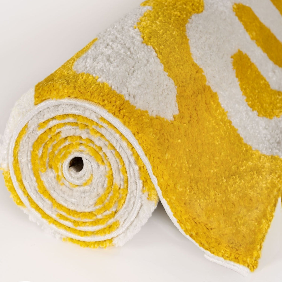 Lemon Scribble Rug — rolled side view