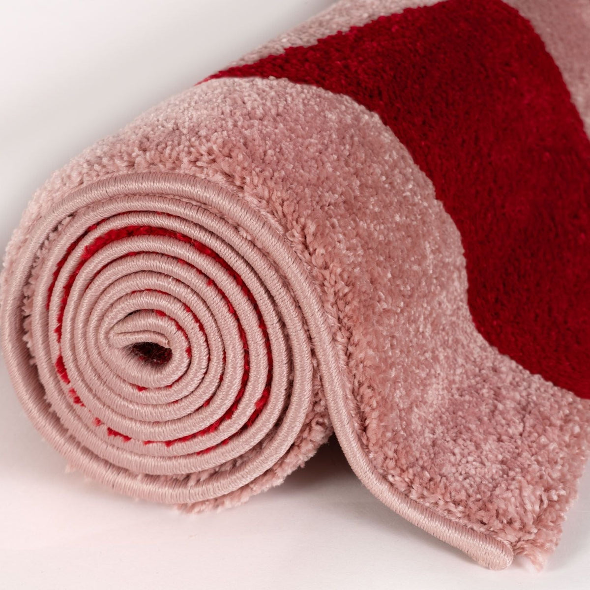 Cherry Check Rug — rolled side view
