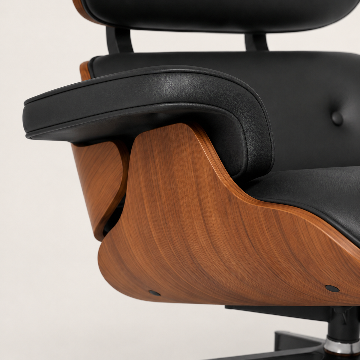 Matching ottoman with black leather-look upholstery and walnut-effect shell