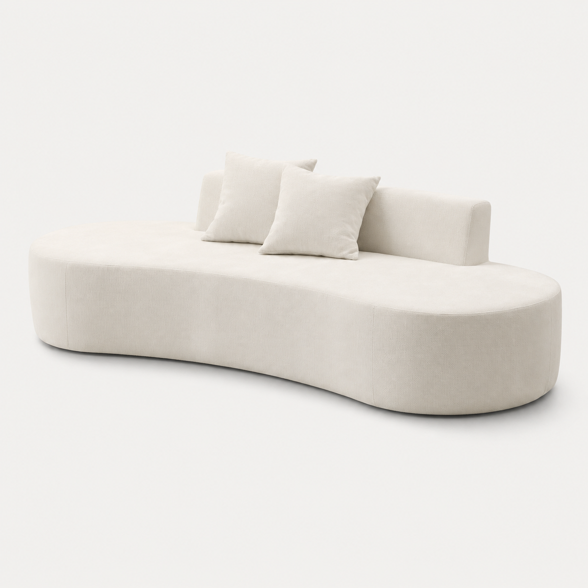 Curved profile and low backrest of The Mallow Chaise Sofa in Beige