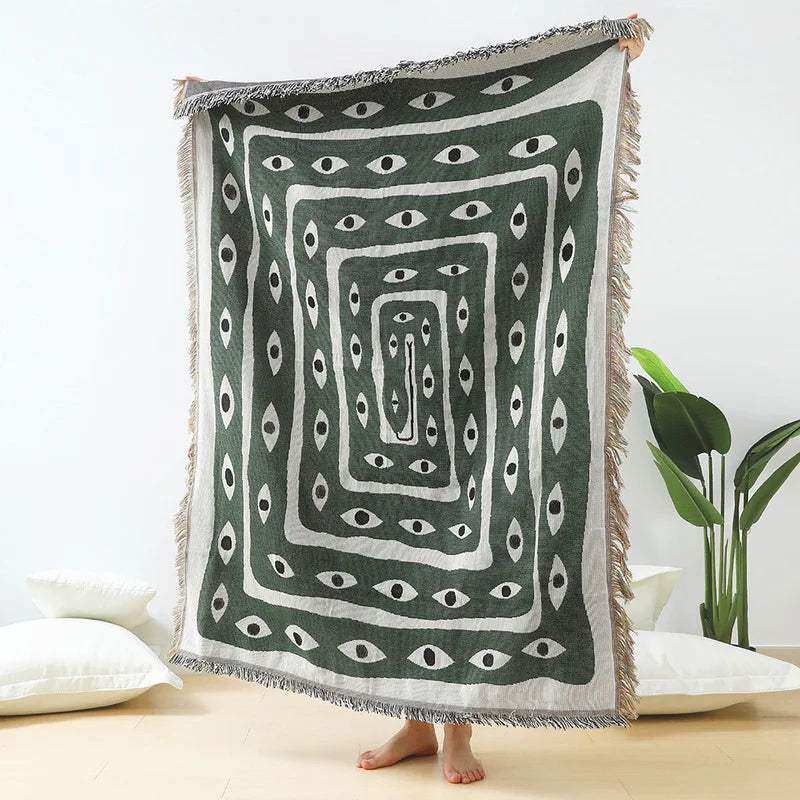 Mystic Gaze woven throw blanket with hypnotic eye motif