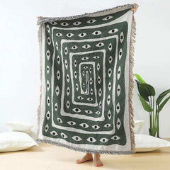 Mystic Gaze woven throw blanket with hypnotic eye motif