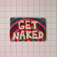 Rainbow bath mat with Get Naked lettering