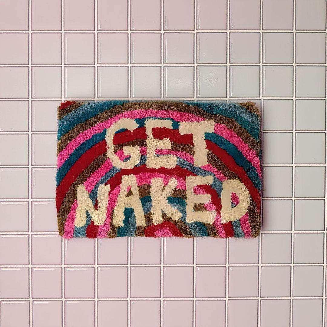Rainbow bath mat with Get Naked lettering