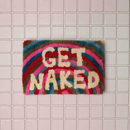 Rainbow bath mat with Get Naked lettering