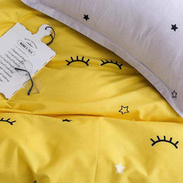 Yellow celestial bedding set in a bright bedroom