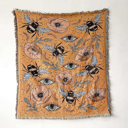 Cotton Bumble Bee throw featuring bees, eye motifs and florals